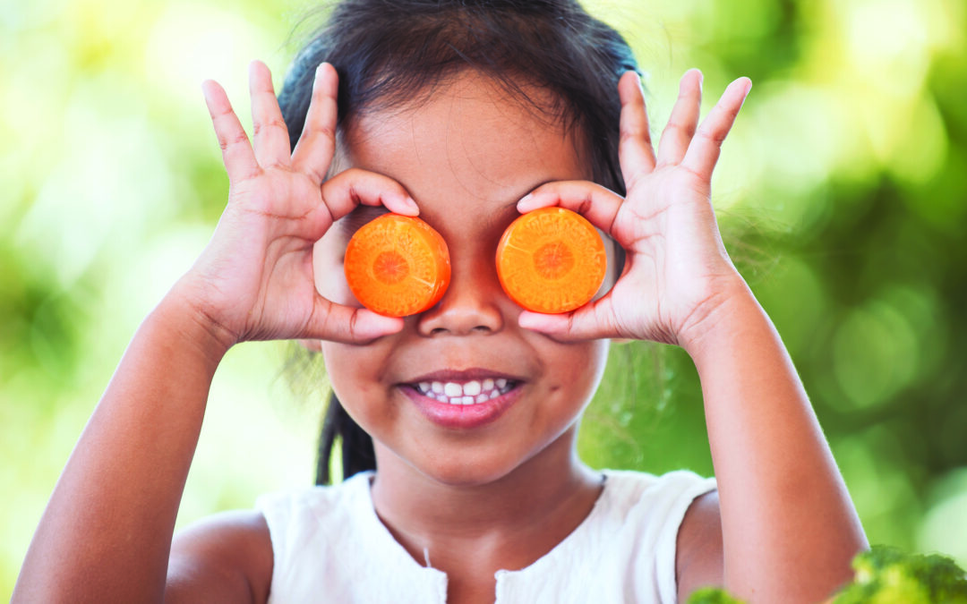 asian girl having fun to learn about vegetables with happiness